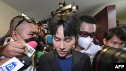 Thai The iCon group founder and CEO Warathaphon Waratyaworrakul, also known as 'Boss Paul', arrives to the Central Investigation Bureau after he was arrested in Bangkok on October 16, 2024.