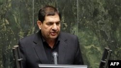 Iran's interim President Mohammad Mokhber addresses lawmakers during the inauguration session for the new Parliament in Tehran on May 27, 2024.