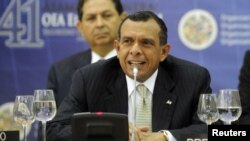 Porfirio Lobo, the President of Honduras, speaks at a session during the ceremony of the 41st General Assembly of the Organisation of American States (OAS) in San Salvador June 6, 2011. The meeting is themed "Security in the Americas", and will see the re