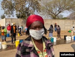 Forty-five-year-old Florence Phiri says residents appreciate that gesture appeals to Clean City to increase the number of bowsers that deliver water to Mabvuku township in Harare, August 20, 2020. (Columbus Mavhunga/VOA)