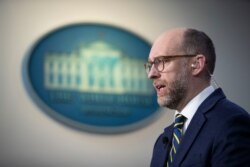 Office of Management and Budget Acting Director Russell Vought speaks during a television interview at the White House, Feb.10, 2020 in Washington.