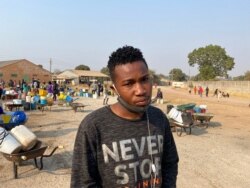 Twenty-three-year-old Chester Musha says he wakes up around 3AM to queue for water or the borehole dries up that day, Harare, Aug. 20, 2020. (Columbus Mavhunga/VOA)