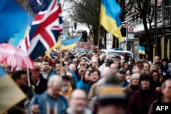 Protesters march toward the Russian Embassy in London on Feb. 22, 2025, in a show of support for Ukraine ahead of the third anniversary of the war.