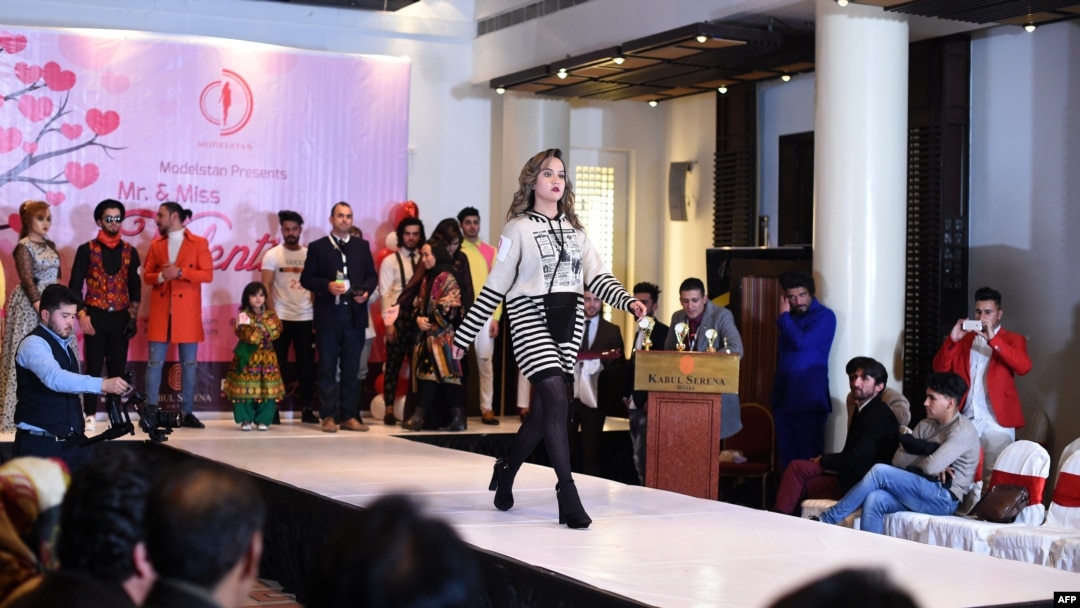 FILE - A model showcases designer clothing at a fashion show at the Serena Hotel in Kabul, Afghanistan, Feb. 14, 2020. The Taliban has denounced a similar event held last week in the Afghan capital as a demonstration of "obscene Western culture."