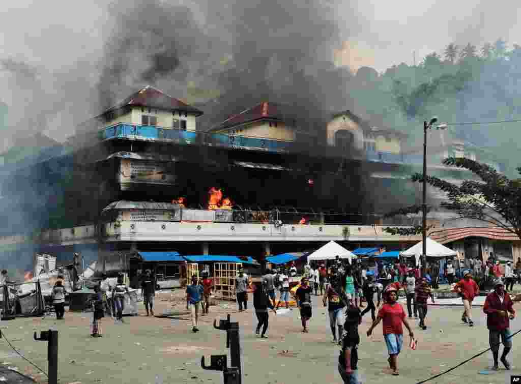 A local market is seen burning during a protest in Fakfak, Papua province, Indonesia, sparked by accusations that security forces had arrested and insulted Papuan students in East Java.