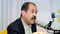 FILE—Tunisian lawyer and opposition leader Chokri Belaid speaks during a radio interview in Tunis on November 20, 2012.