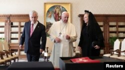 Pope Francis speaks as he meets with Chile's President Sebastian Pinera and his wife, Cecilia Morel, during a private audience at the Vatican, Oct. 13, 2018. 