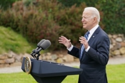 FILE - U.S. President Joe Biden speaks about his administration's pledge to donate 500 million doses of the Pfizer coronavirus vaccine to the world's poorest countries, during a visit to St. Ives in Cornwall, England, June 10, 2021.