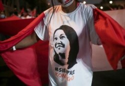 A supporter wears a shirt with an image of Peru's presidential candidate Keiko Fujimori that reads, "Always with you," in Lima, Peru, June 26, 2021.