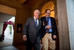 House Majority Leader Steny Hoyer of Md.(L) arrives for a House Democratic caucus meeting on Capitol Hill in Washington, July 10, 2019.