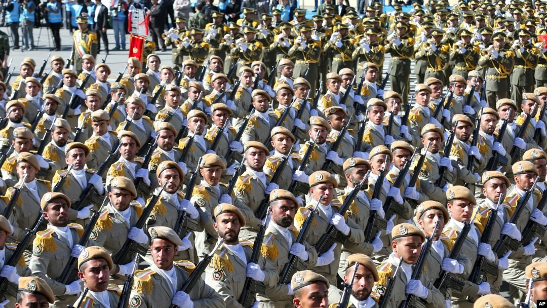 FILE - Iranian army troops march in a parade marking National Army Day just outside Tehran, Iran, April 17, 2016. A new force was announced Thursday, designed to fight in Arab countries and would recruit heavily from non-Iranian Shi'ite Muslims across the region.