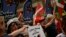 A demonstrator carries a flag calling for the return to Basque Country of the all prisoners of the Basque separatist armed group ETA while marching in the northern Spanish city of Bilbao, northern Spain, April 21, 2018, to demand that imprisoned members of the militant Basque group ETA be moved to prisons closer to their homes.