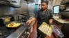 Johkiya Pierre prepares a fresh omelet at The Breakfast Brothers restaurant, Feb. 12, 2025, in Arlington, Texas.