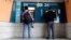 People use ATMs outside a closed branch of the Bank of Cyprus in capital Nicosia, Cyprus, Mar. 27, 2013.