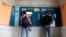 People use ATMs outside a closed branch of the Bank of Cyprus in capital Nicosia, Cyprus, Mar. 27, 2013.