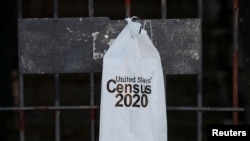 A packet from the U.S. Census 2020 hangs on a door amid the coronavirus disease (COVID-19) outbreak on Whidbey Island, Washington, U.S., March 21, 2020. 