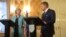 British Prime Minister Theresa May, left, speaks during a joint press briefing with Slovak Prime Minister Robert Fico, right, Bratislava, Slovakia, July 28, 2016. 