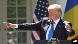 President Donald Trump speaks during a news conference in the Rose Garden at the White House in Washington, June 9, 2017.