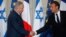 French President Emmanuel Macron and Israel's Prime Minister Benjamin Netanyahu shake hands as they attend a joint press conference at the Elysee Palace in Paris, June 5, 2018.