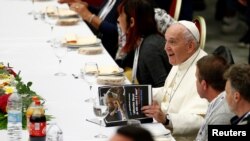 Pope Francis attends a lunch with the poor after celebrating a Mass marking the Roman Catholic Church's World Day of the Poor, in Paul VI Hall at the Vatican, Nov. 17, 2019. 