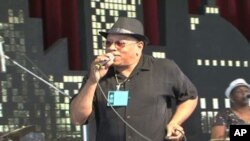 The Funk Brothers band, a famous R&B group from the 1960s, performs at the Smithsonian Folklife Festival.