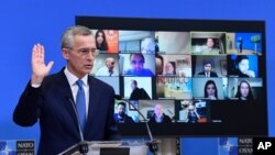 NATO Secretary General Jens Stoltenberg gestures as he addresses a media conference following a virtual meeting of NATO defense ministers at NATO headquarters in Brussels, Belgium, Feb. 17, 2021.