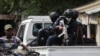 Police patrol the area due to gang activity that has forced residents to flee their homes, in Port-au-Prince, Haiti, Oct. 20, 2024.