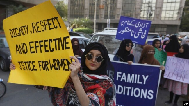 Pakistanis take part in a pro-women rally ahead of Women's Day in Karachi, Pakistan, Friday, March 6, 2020. 