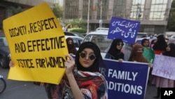Pakistanis take part in a pro-women rally ahead of International Women's Day, in Karachi, Pakistan, March 6, 2020.
