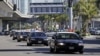 File - Police vehicles driving through Los Angeles International Airport.