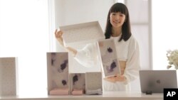 Marie Kondo introduces her new line of storage boxes during a media event in New York, Wednesday, July 11, 2018. (AP Photo/Seth Wenig)