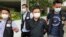 Ryan Law, second from right, Apple Daily's chief editor, is arrested by police officers in Hong Kong Thursday, June 17, 2021. (AP)