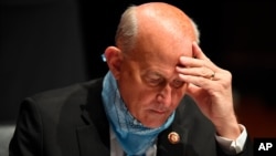 FILE - Republican Congressman Louie Gohmert studies notes during a House Judiciary Committee hearing on Capitol Hill, in Washington, July 28, 2020.