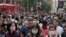People wear masks on a street in Hong Kong, Jan. 24, 2020.