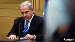 Israel's Prime Minister Benjamin Netanyahu attends a Likud-Beitenu party meeting, at the Knesset, the Israeli parliament, in Jerusalem, Mar. 14, 2013.