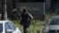 Officers run toward a YouTube office in San Bruno, Calif., Tuesday, April 3, 2018. Police and federal officials have responded to reports of a shooting Tuesday at YouTube headquarters in Northern California. 