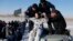 U.S. astronaut Randy Bresnik is being pulled from a Russian Soyuz MS-05 space capsule shortly after it landed about 150 km (80 miles) south-east of the town of Zhezkazgan, Kazakhstan, Dec. 14, 2017.