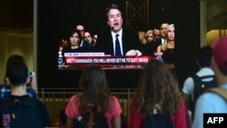 Students at the University of Southern California watch a live telecast of the testimony from Brett Kavanaugh concerning sexual assault allegations from Christine Blasey Ford, Sept. 27, 2018, at the Annenberg School for Communications and Journalism in Los Angeles.