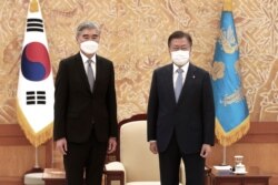 South Korean President Moon Jae-in, right, and U.S. Special Representative for North Korea, Sung Kim, pose for photos prior to their meeting at the presidential Blue House in Seoul, South Korea, June 22, 2021. Kim Yo Jong, the powerful sister of…