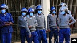 FILE: Zimbabwe police seen in Harare, Friday, June, 5, 2020. 