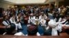 FILE - Mullah Abdul Ghani Baradar, the Taliban group's top political leader, left, Sher Mohammad Abbas Stanikzai, the Taliban's chief negotiator, second left, and other members of the Taliban delegation speak to reporters prior to their talks in Moscow, R