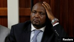 FILE - Kenyan politician Moses Kuria sit in the dock at the Milimani Law Courts over alleged "hate speech," flagging growing tension in Kenya's capital Nairobi, June 14, 2016. 