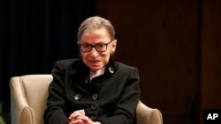 FILE - Supreme Court Associate Justice Ruth Bader Ginsberg attends Georgetown Law School's second annual Ruth Bader Ginsburg Lecture, Oct. 30, 2019, in Washington.