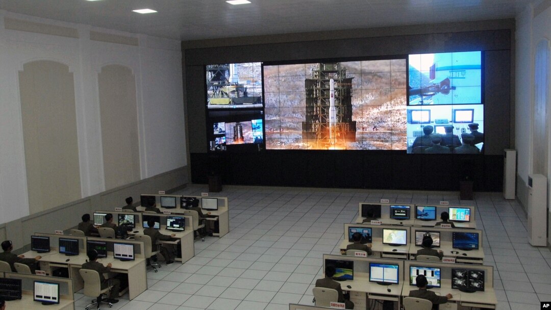 Scientists and technicians at the General Satellite Control and Command Center on the outskirts of Pyongyang watch the launch of the Unha-3 rocket from a launch site on the west coast, in the village of Tongchang-ri, North Korea, December 12, 2012.