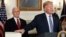 Президент Трамп держит руку на тексте бюджетного законопроекта 