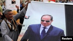 Para pendukung Presiden Abdel Fattah el-Sisi merayakan kemenangannya dalam pilpres, di Lapangan Tahrir, Kairo 2 April 2018 lalu.