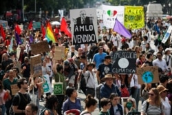 Demonstrators march during the global protest on climate change in Mexico City, Sept. 20, 2019.