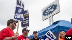 FILE - Members of the United Auto Workers picket outside of the Michigan Parts Assembly Plant in Wayne, Michigan, on Sept. 26, 2023.