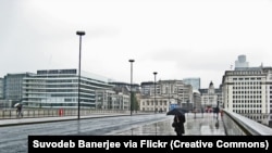 Walking across London Bridge on a rainy, wet day in June 2011 