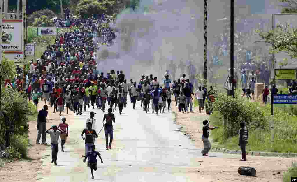 Protesters gather on the streets during demonstrations over the increase in fuel prices in Harare, Zimbabwe.